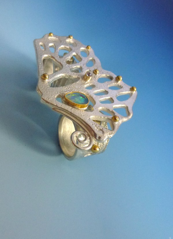 Vanishing Butterfly Ring: I made a double finger ring to match my Vanishing Butterfly Necklace. This is made of silver, gold, white sapphire and opals.
