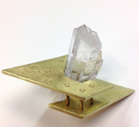 This is another riveted overlay example made by student, Jackie Hall. She fabricated this piece out of brass and quartz crystal. 