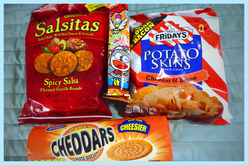 Savory snacks: Salsitas, T.G.I. Friday's Potato Skins, and McVitie's Chedders cheese biscuits.