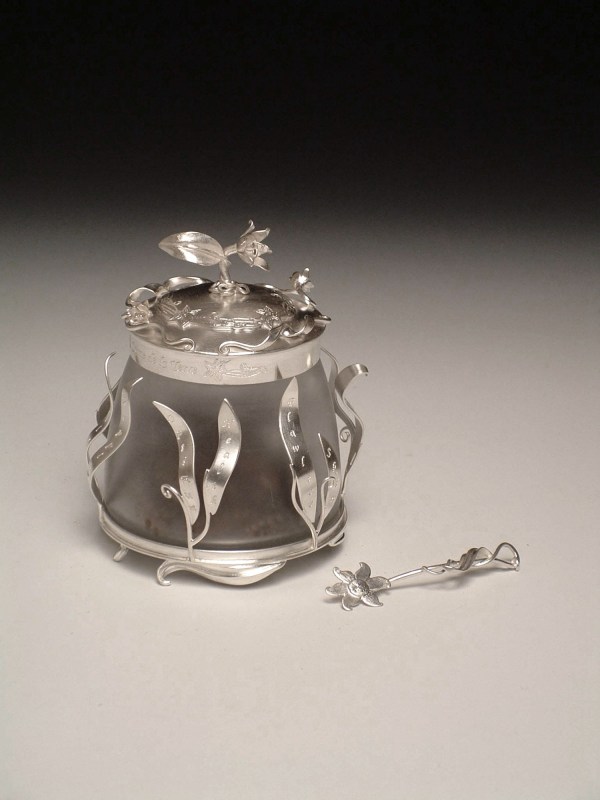 Creme de la Terre: This piece was a part of my MFA thesis exhibition, "Instruments of Vanity". I fabricated this jar and spatula out of sterling silver, glass, lotion, and fishing tackle. 