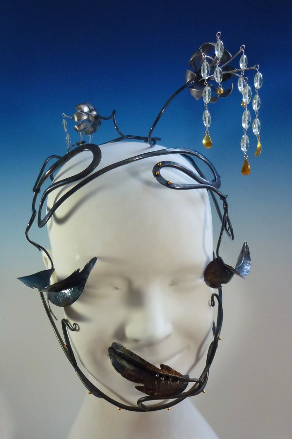 Savage Beauty: This is a head piece based on the kudzu plant. I fabricated this piece from antiqued sterling silver, 18kt gold, and prasiolite beads.