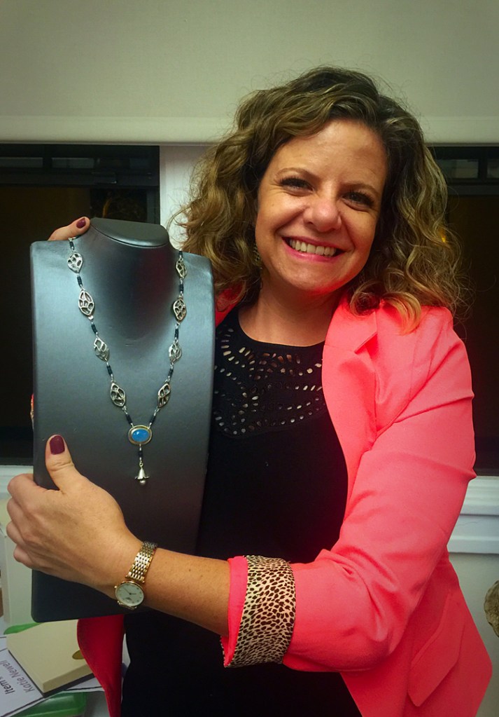 Eliana Zepeda Graham's Necklace: Falling Petals. She is seen here modeling with her piece. She incorporated a stylized silver chinese lantern that I made into her necklace. 