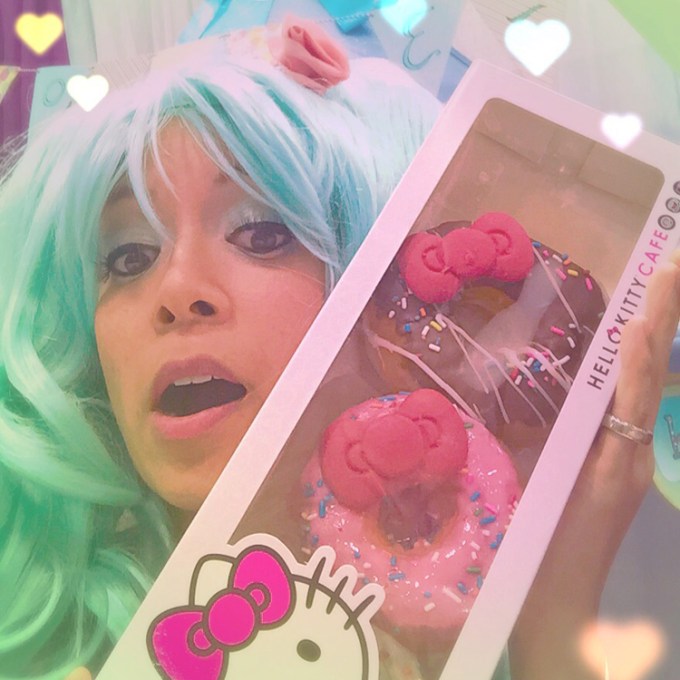 This is a very playful sea foam blue wig with double ponytails that I purchased at Comic-Con last year from Epic Cosplay. It definitely is reminiscent of the vocaloid singer, Hatsune Miku. Here, I'm displaying my ultimate prize finding from Comic-Con: Hello Kitty Donuts!