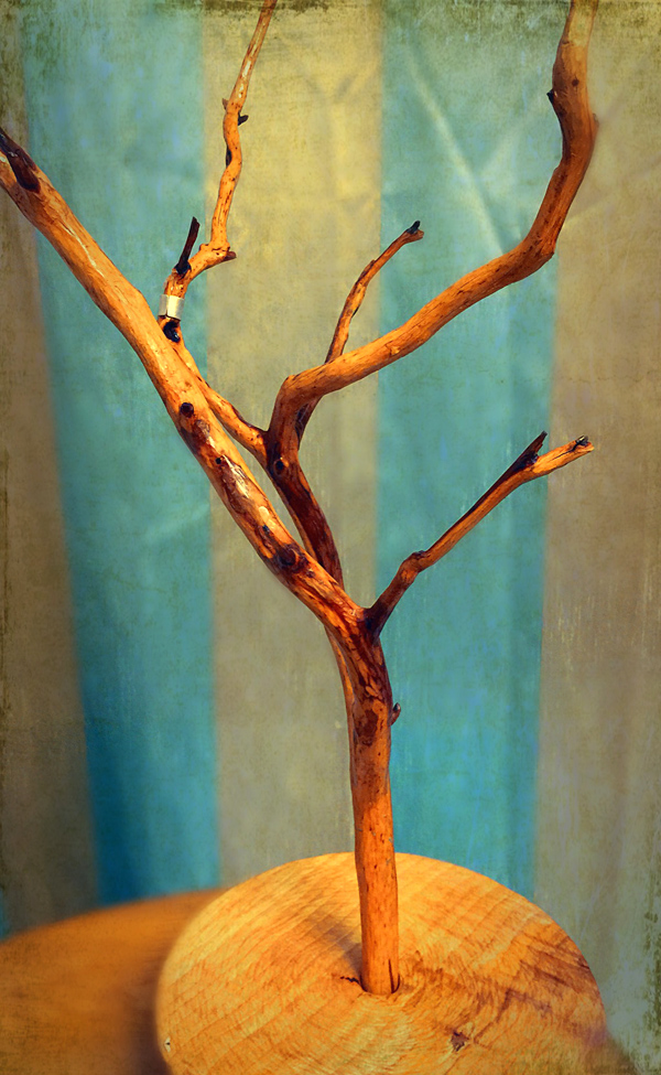 My necklace tree stand with hand carved base.